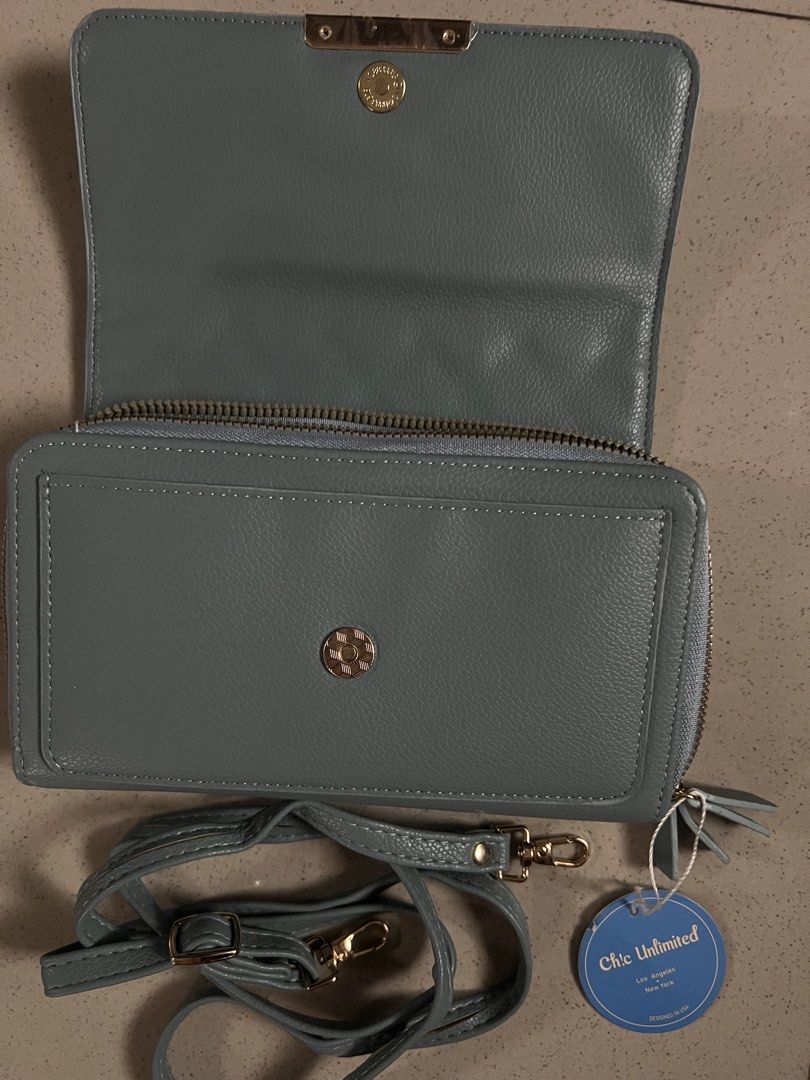 Chic Unlimited Quilted Wallet Purse with Strap (Category: Wallets & Card holders) located in Angeles City. Submitted by safe.simpledesign (Listing ID 1455932394, Image 2). Description: - Chic light blue quilted wallet purse - Features a secure zip compartment - Multiple card slots for organization - Includes a convenient detachable strap - Elegant gold hardware details - Brand new with tag still attached - Generous size: approximately 8 inches wi
