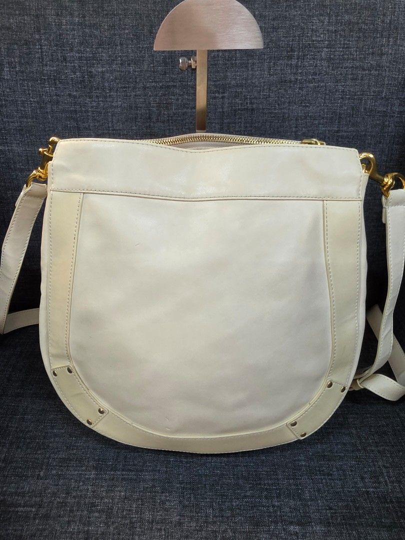 Chloe Leather Handbag (Category: Luxury Bags & Wallets) located in General Trias. Submitted by roselle2230 (Listing ID 1455999502, Image 2). Description: - Genuine white leather Chloe handbag - Elegant gold hardware details - Luxurious red fabric interior lining - Proudly made in Bulgaria - Serial number clearly visible inside - A quintessential Chloe classic piece.