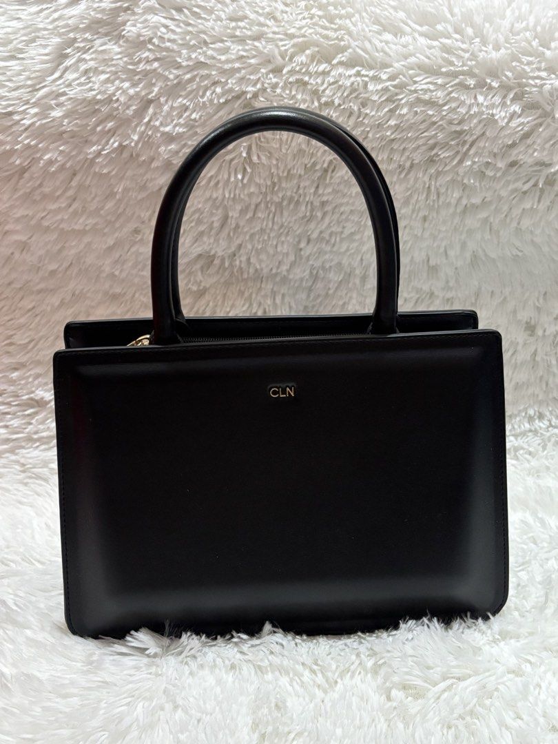 CLN Jairel Black Hand bag Handbag (Category: Purses & Pouches) located in Calamba. Submitted by jjongtoram (Listing ID 1455919742, Image 1). Description: Inclusions: strap (never been used) & cloth bag. Used not more than 5x MOP: gcash MOD: j&t or lalamove LOC: calamba laguna.