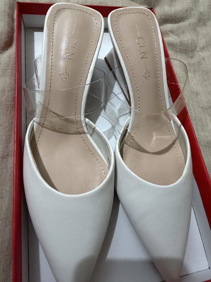 CLN White Elaine Mules Heels Size 37 (Category: Heels) located in Mandaluyong City. Submitted by unique_100_findsph (Listing ID 1455964741, Image 3). Description: - Brand: CLN - Type: Mules - Color: White - Toe Style: Pointed - Features: Clear strap, Block heel - Size: 37 - Condition: Used only ONCE - Includes: Original box.
