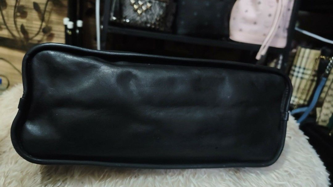 Coach Alma (Category: Luxury Bags & Wallets) located in Manila. Submitted by bellissima05 (Listing ID 1455959570, Image 2). Description: Description: Structured Coach satchel in black embossed leather. Signature 'C' pattern across the body. Gold-tone hardware and chain accents. Top handles and a detachable strap for versatility. Sleek, polished look for everyday or special occasions..