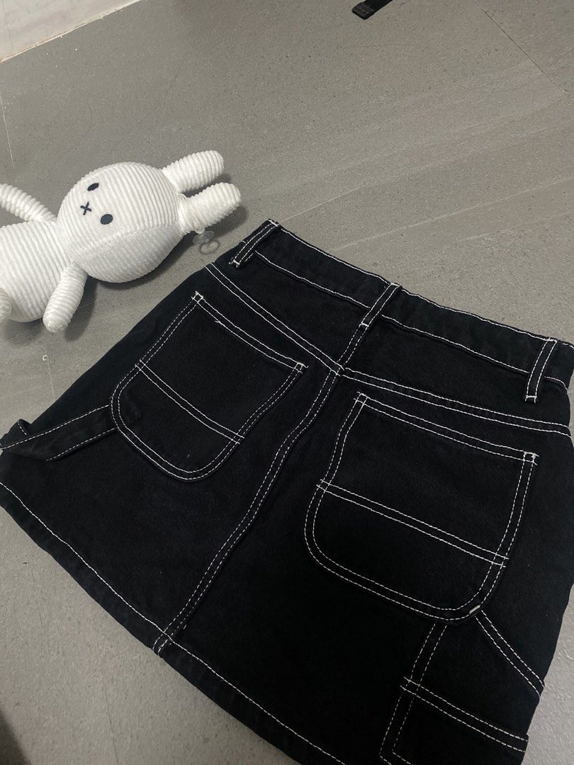 Cotton On Black Cargo Denim Mini Skirt (Category: Skirts) located in Caloocan City. Submitted by ellianaaaa (Listing ID 1455923399, Image 2). Description: - Black denim mini skirt from Cotton On - Cargo style with white contrast stitching - Features pockets on the front and back - Secure button and zip closure - Ideal for casual wear and easy to style.