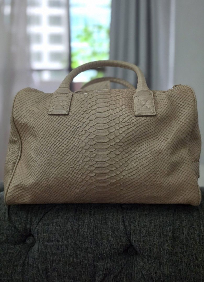 Couronne Python Embossed Leather Handbag with Sling (Category: Luxury Bags & Wallets) located in Manila. Submitted by amc88 (Listing ID 1456022644, Image 2). Description: - Beige Couronne handbag - Python-embossed leather - Gold-tone zipper and hardware - Includes matching leather tag - Spacious interior for essentials - Versatile for daily use or special occasions.