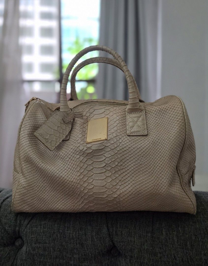 Couronne Python Embossed Leather Handbag with Sling (Category: Luxury Bags & Wallets) located in Manila. Submitted by amc88 (Listing ID 1456022644, Image 1). Description: - Beige Couronne handbag - Python-embossed leather - Gold-tone zipper and hardware - Includes matching leather tag - Spacious interior for essentials - Versatile for daily use or special occasions.