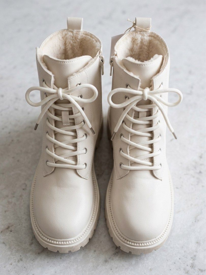 Cream Lace-up Fur Lined Combat Boots (Category: Boots) located in Manila. Submitted by silverhawk.069da5 (Listing ID 1455903397, Image 1). Description: - Cream colored combat boots - Lace-up front with convenient side zippers - Lined with soft faux fur for ultimate warmth - Chunky sole for added style and comfort - Perfect for colder weather and everyday wear.