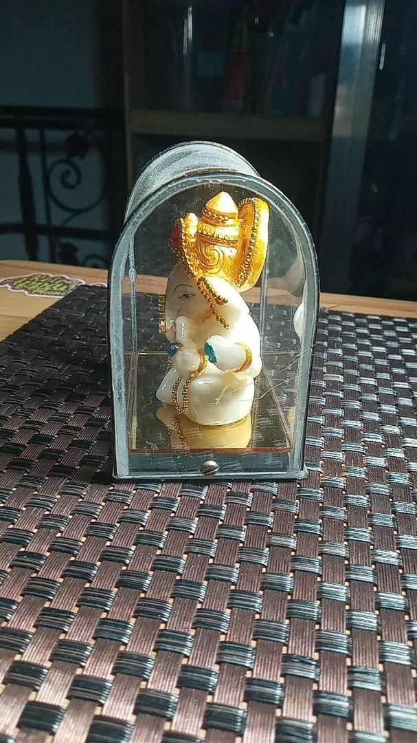 Decorative Ganesha Idol in Display Case (Category: Religious Items) located in Paranaque City. Submitted by zuprocsejon38604 (Listing ID 1456009629, Image 3). Description: - Adorable Ganesha idol in white and gold with vibrant gem accents. - Comes in a clear display case with elegant gold trim. - Ideal for enhancing your home decor or as a thoughtful gift. - Brings a spiritual and serene ambiance to any room..