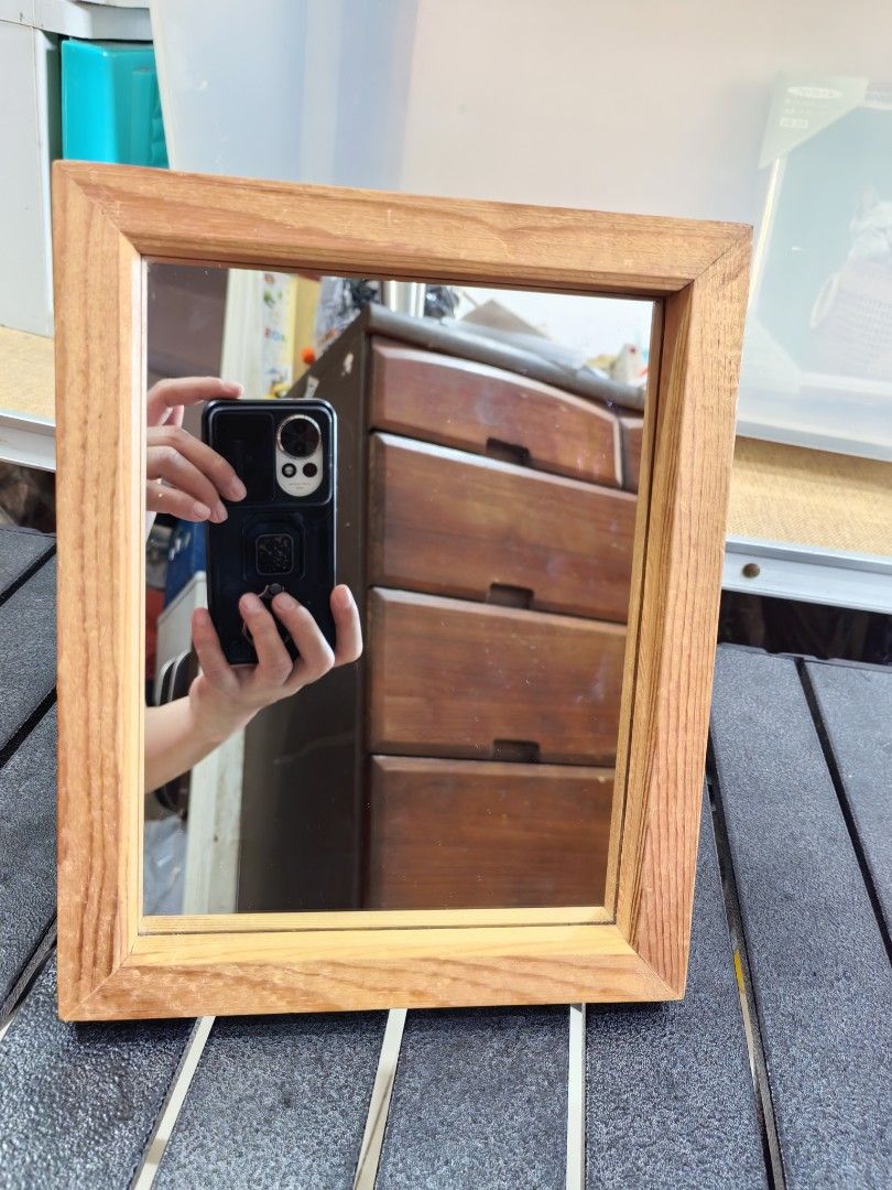 Desktop Vanity Makeup Mirror (Category: Mirrors) located in Cebu City. Submitted by dudes_villanueva (Listing ID 1455866787, Image 2). Description: Desktop Vanity Makeup Mirror 📌 Enclosed in a light-colored, natural wooden frame. 📌 Features exposed, thick wood grains with mitered joints at the corners, giving it a classic rustic aesthetic. 📌 Place it on a bedroom vanity or dresser to serve as a compact, functional makeup station. Measurement: 