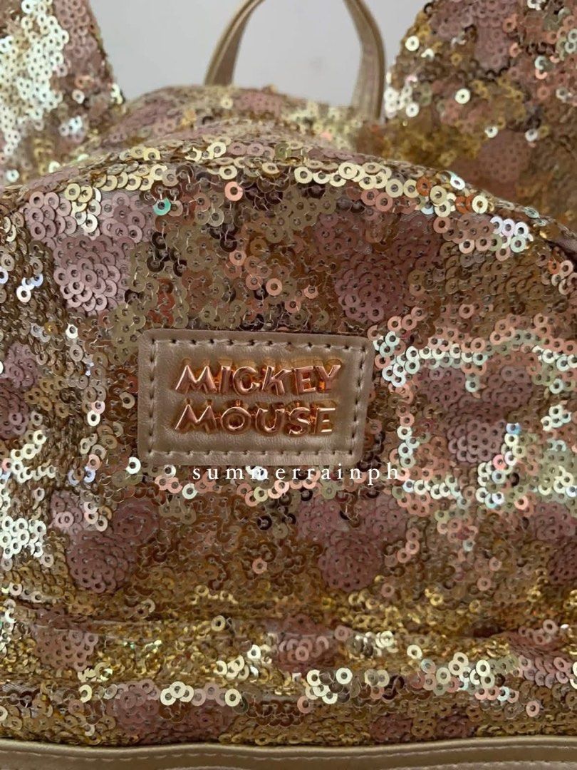 MICKEY BAG AVAILABLE (Category: Diaper Bags & Wetbags) located in Valenzuela. Submitted by summerrainph (Listing ID 1455897349, Image 2). Description: * Sequin with minnie / mickey logo * Mickey / Minnie ears design * Top handle + soft adjustable back straps * Double easy pull up zip opening * Mini but spacious * Front zip pocket * 27*23*10 cm.
