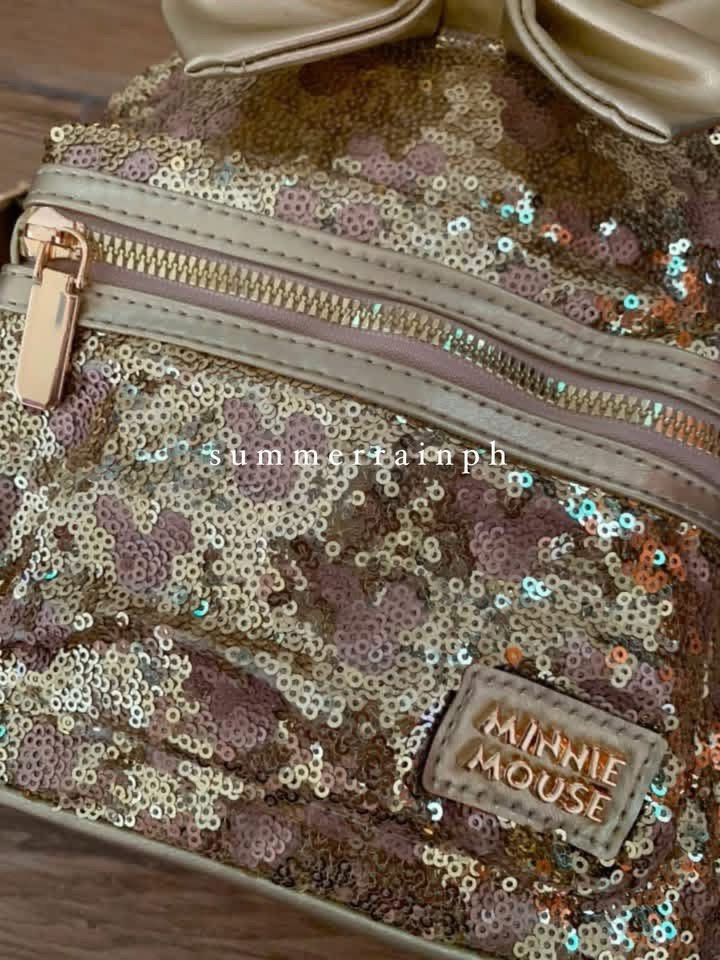DISNEY MICKEY / MINNIE BAG (Category: Diaper Bags & Wetbags) located in Valenzuela. Submitted by summerrainph (Listing ID 1455897349, Image 2). Description: * Sequin with minnie / mickey logo * Mickey / Minnie ears design * Top handle + soft adjustable back straps * Double easy pull up zip opening * Mini but spacious * Front zip pocket * 27*23*10 cm.