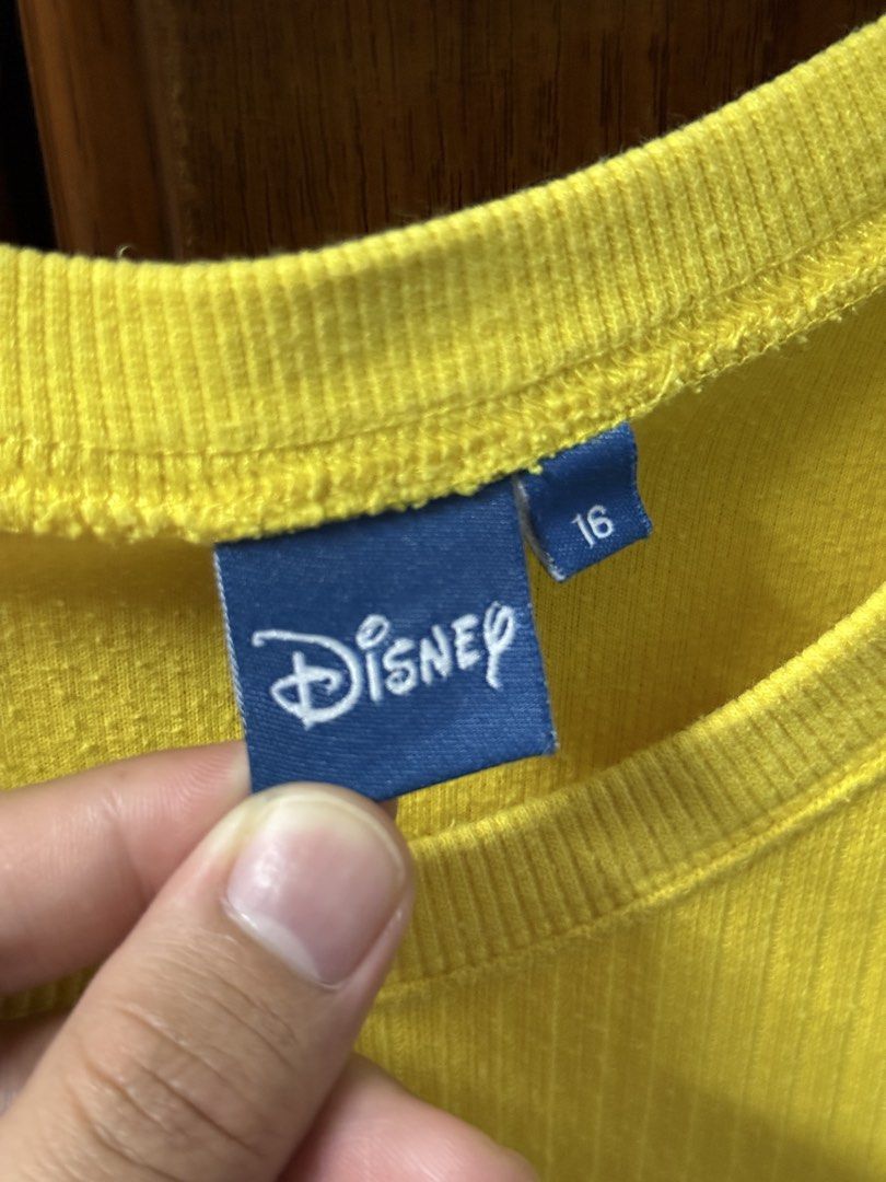 Disney Mickey Mouse Yellow Ribbed Sweatshirt Size 16 (Category: Longsleeves) located in Cavite. Submitted by g1mon (Listing ID 1455995947, Image 3). Description: This item is preloved (not thrifted) Tagged size: 16 Measurements (inches): Pit-to-pit: 19 Length: 23.8 Issues: Small yellow streak on Mickey's face as seen in the pic *Note: Lighting may affect the colour in the image* - Bright yellow Disney sweatshirt - Features a classic Mickey Mouse 