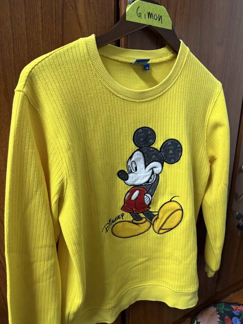 Disney Mickey Mouse Yellow Ribbed Sweatshirt Size 16 (Category: Longsleeves) located in Cavite. Submitted by g1mon (Listing ID 1455995947, Image 1). Description: This item is preloved (not thrifted) Tagged size: 16 Measurements (inches): Pit-to-pit: 19 Length: 23.8 Issues: Small yellow streak on Mickey's face as seen in the pic *Note: Lighting may affect the colour in the image* - Bright yellow Disney sweatshirt - Features a classic Mickey Mouse 