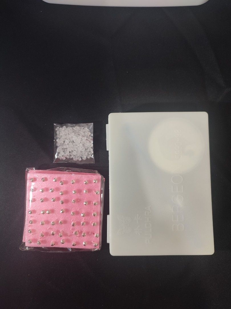 Ear Piercing Gun Kit with Studs and Accessories (Category: Earrings) located in Marikina City. Submitted by surplusbuffet (Listing ID 1455943189, Image 3). Description: - Complete ear piercing kit - Includes piercing gun, marker, and small mirror - Comes with a box of starter earrings and a bag of earring backs - All items organized in a convenient case - Ideal for personal use or professional services.