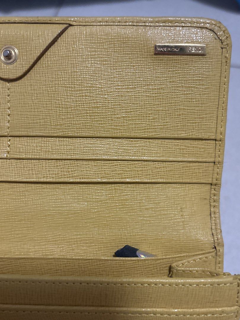 Fendi Yellow Leather Long Wallet (Category: Luxury Bags & Wallets) located in Marikina City. Submitted by thezoneforgoodfinds (Listing ID 1456013107, Image 2). Description: - Authentic Yellow Fendi Wallet - Made in Italy - Secure Snap Closure - Ample Card Slots - Ideal for everyday use.