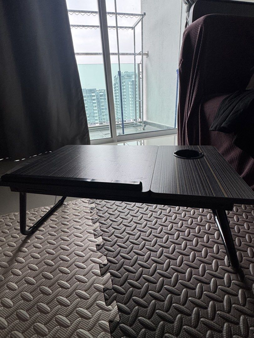 Foldable & adjustable table (Category: Tables & Sets) located in Kuala Lumpur. Submitted by jc40_09 (Listing ID 1455959786, Image 2). Description: Table that’s adjustable (picture shown) Suitable to put on bed for work .