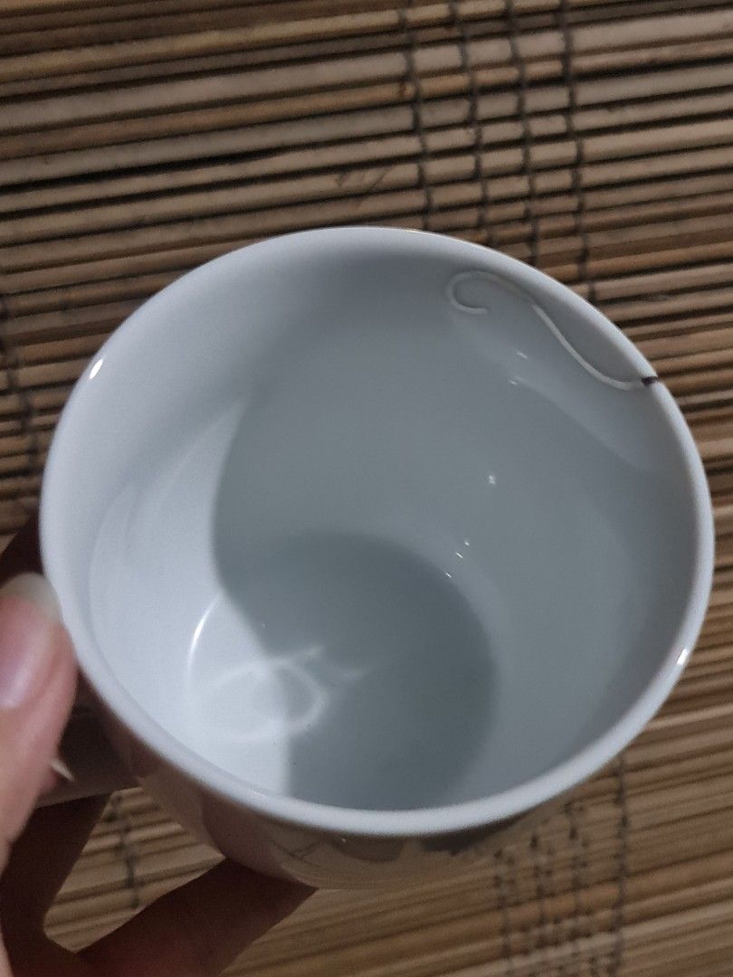 Francfranc Silver Swirl Mug (Category: Coffee & Tea Tableware) located in Caloocan City. Submitted by shane_malik (Listing ID 1455895251, Image 3). Description: Francfranc - Classic white mug with a simple silver swirl design. - Features the Francfranc logo on the bottom. - Ideal for your morning coffee or tea. - Interior is clean. - Handle is intact and sturdy. - A minimalist yet lovely piece to enhance your kitchenware collection..