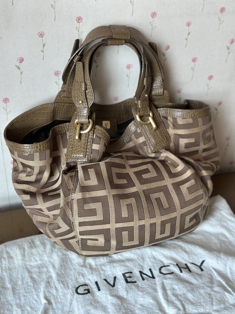 Givenchy Monogram Canvas and Leather Shoulder Bag (Category: Luxury Bags & Wallets) located in Quezon City. Submitted by gaylechu13 (Listing ID 1455897014, Image 3). Description: Authentic Givenchy Iconic G monogram canvas with leather trim hobo bag FOR SALE!! ✅ 100% Authentic and Genuine Leather ✅ Comes with original dust bag ✅ Bought from Hong Kong ✅ Gold hardware details ✅ Interior zip pocket and slip pocket ✅ Comes with original dust bag ✅ PH
