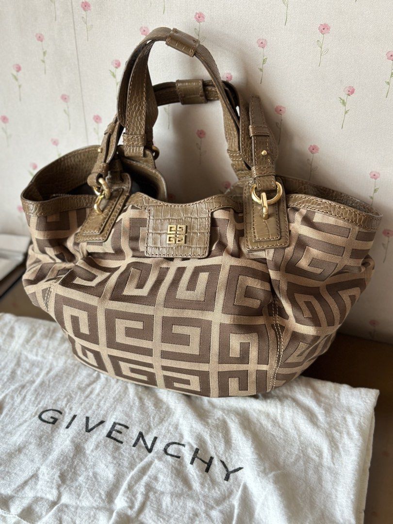 Givenchy Monogram Canvas and Leather Shoulder Bag (Category: Luxury Bags & Wallets) located in Quezon City. Submitted by gaylechu13 (Listing ID 1455897014, Image 1). Description: Authentic Givenchy Iconic G monogram canvas with leather trim hobo bag FOR SALE!! ✅ 100% Authentic and Genuine Leather ✅ Comes with original dust bag ✅ Bought from Hong Kong ✅ Gold hardware details ✅ Interior zip pocket and slip pocket ✅ Comes with original dust bag ✅ PH