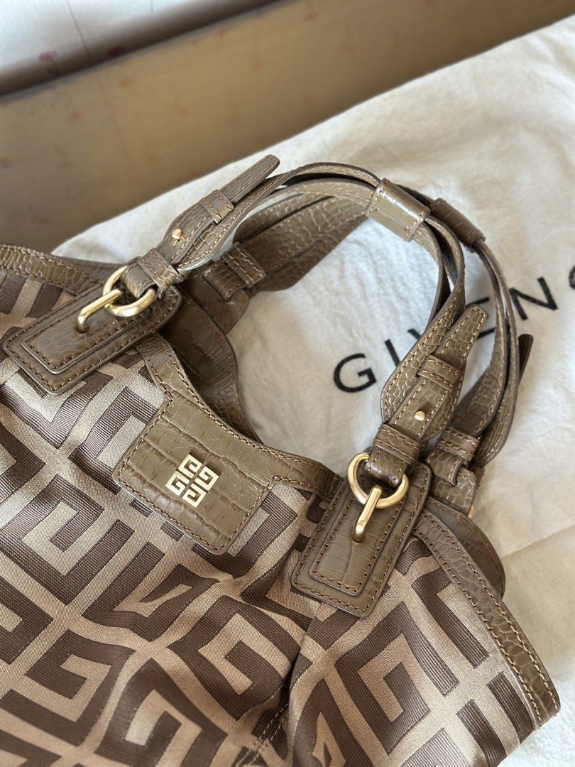 Givenchy Monogram Canvas and Leather Shoulder Bag (Category: Luxury Bags & Wallets) located in Quezon City. Submitted by gaylechu13 (Listing ID 1455897014, Image 2). Description: Authentic Givenchy Iconic G monogram canvas with leather trim hobo bag FOR SALE!! ✅ 100% Authentic and Genuine Leather ✅ Comes with original dust bag ✅ Bought from Hong Kong ✅ Gold hardware details ✅ Interior zip pocket and slip pocket ✅ Comes with original dust bag ✅ PH