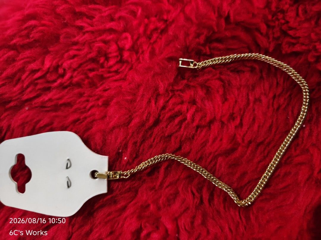 Gold Chain Bracelet with Clasp (Category: Bracelets) located in Consolacion. Submitted by mencytte (Listing ID 1455870926, Image 2). Description: - Gold-colored chain bracelet - Features a twisted link design - Simple clasp closure - Attached to a white card - Ideal for everyday wear or as a gift.