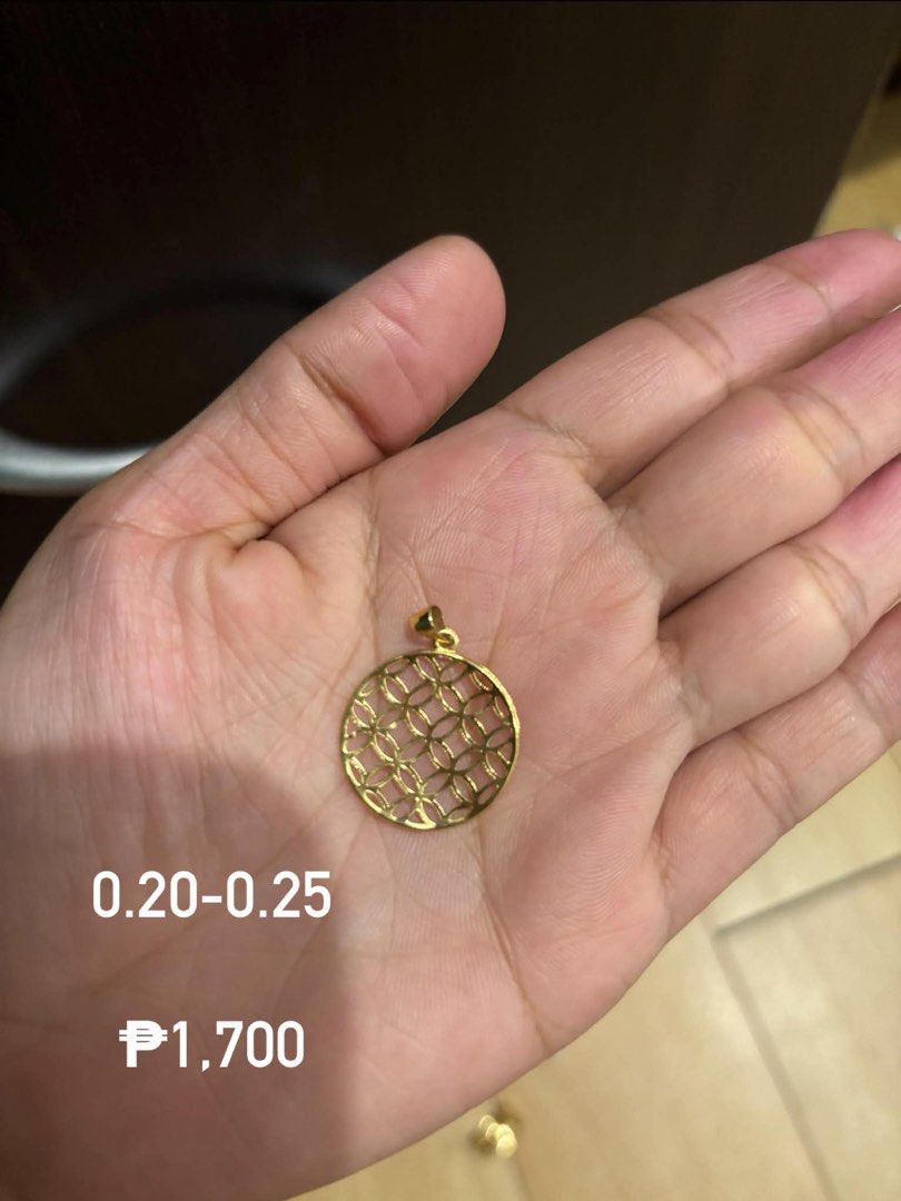Gold Geometric Circle Pendant 0.20-0.25 (Category: Charms) located in Manila. Submitted by style_reset (Listing ID 1455944199, Image 1). Description: - Genuine gold pendant - Features a stylish geometric pattern - Weight: 0.20-0.25 grams - Price: P1,700 - Versatile for everyday or special occasions - Enhance your jewelry collection with this beautiful piece.