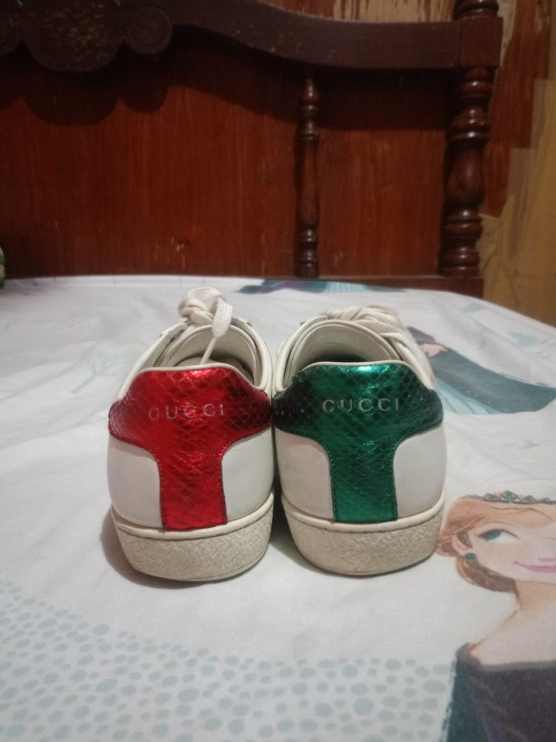 Gucci Ace Bee Sneakers White Green Red (Category: Sneakers) located in Davao. Submitted by cleo1812 (Listing ID 1456000335, Image 3). Description: - White Leather Gucci Ace Sneakers - Iconic Green and Red Stripe - Gold Bee Embroidery Detail - Snake-Embossed Green & Red Leather Heel - Classic Gucci Design ‼️Need wash or thorough cleaning ‼️ SIZE 38 1/2.