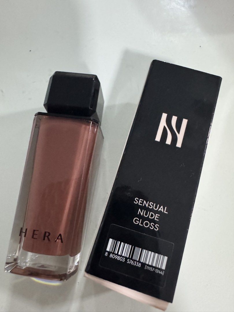 HERA Sensual Nude Gloss 462 Speechless (Category: Makeup) located in Manila. Submitted by decluterthings888 (Listing ID 1455866939, Image 2). Description: - Product: HERA Sensual Nude Gloss - Shade: 462 Speechless - Finish: Glossy - Color: Beautiful nude shade - Packaging: Sleek and modern - Best for: Everyday wear, natural look, achieving a perfect pout.