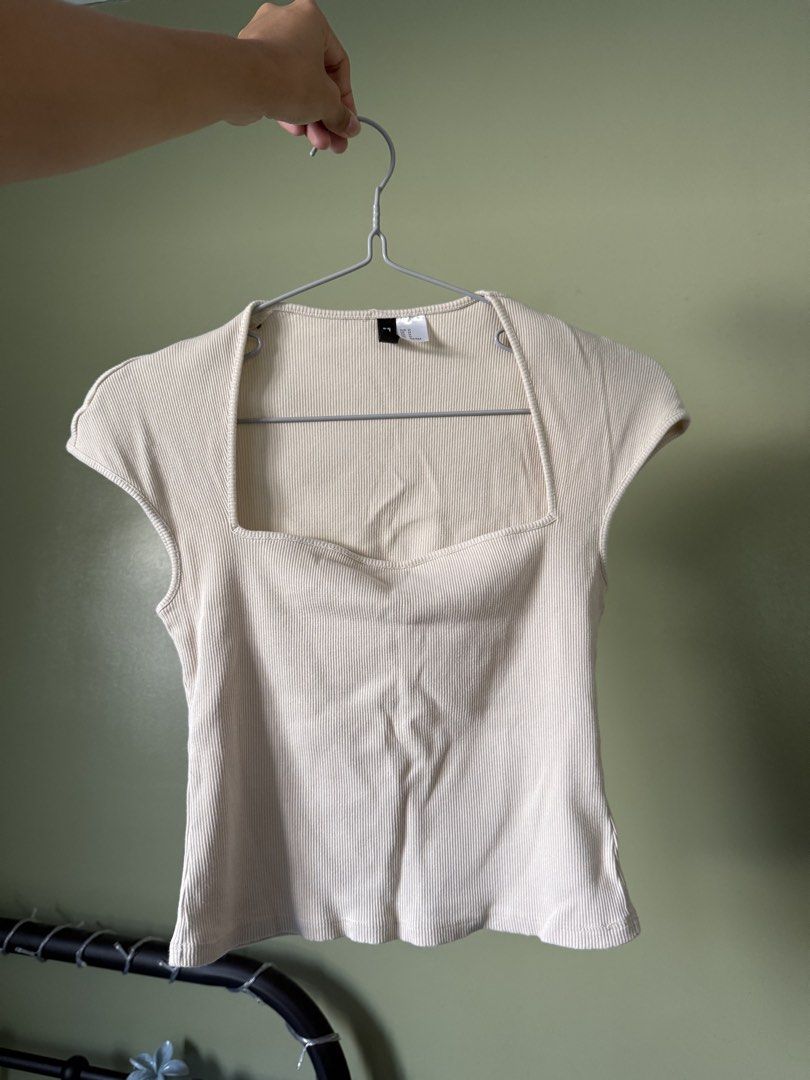 H&M Ribbed Square Neck Cap Sleeve Top Cream (Category: Blouses) located in Manila. Submitted by yonderingheights (Listing ID 1455927723, Image 2). Description: - Cream ribbed top from H&M - Features a flattering square neckline - Comfortable cap sleeves - Made with stretchy material for a great fit - Perfect basic piece to pair with jeans or skirts - Easily dressed up or down for any occasion.