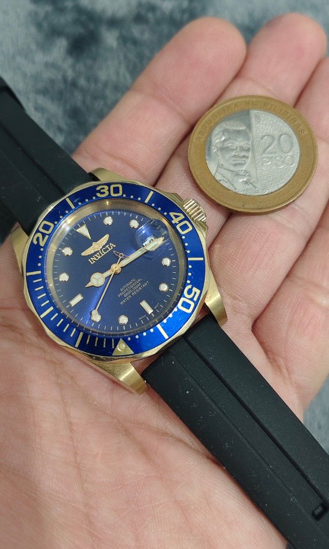 Invicta Pro Diver 200m (Category: Men's Watches) located in Cebu City. Submitted by aceoftime (Listing ID 1456028090, Image 3). Description: In good working condition Powered by Japanese Miyota automatic movt with date display Blue dial and bezel in gold tone case Unidirectional rotating bezel Fitted with black rubber strap Watch only Our Guarantee: 💯 Authentic All watches are checked by our experienced tech to ensure good functionality Please m