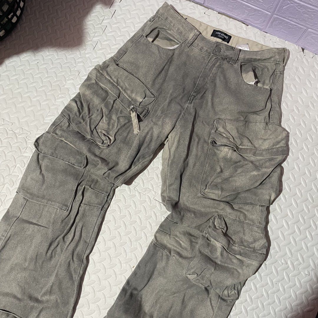 IVN BRAND Grey Washed Cargo Pants (Category: Jeans) located in Zamboanga. Submitted by selvege (Listing ID 1455906553, Image 2). Description: - IVN BRAND Grey Washed Cargo Pants - Baggy fit, estimated size 32 waist - Multiple pockets, some with zippers - Ideal for a streetwear aesthetic - Feel free to ask questions! W32 L43 Hem 10.5.