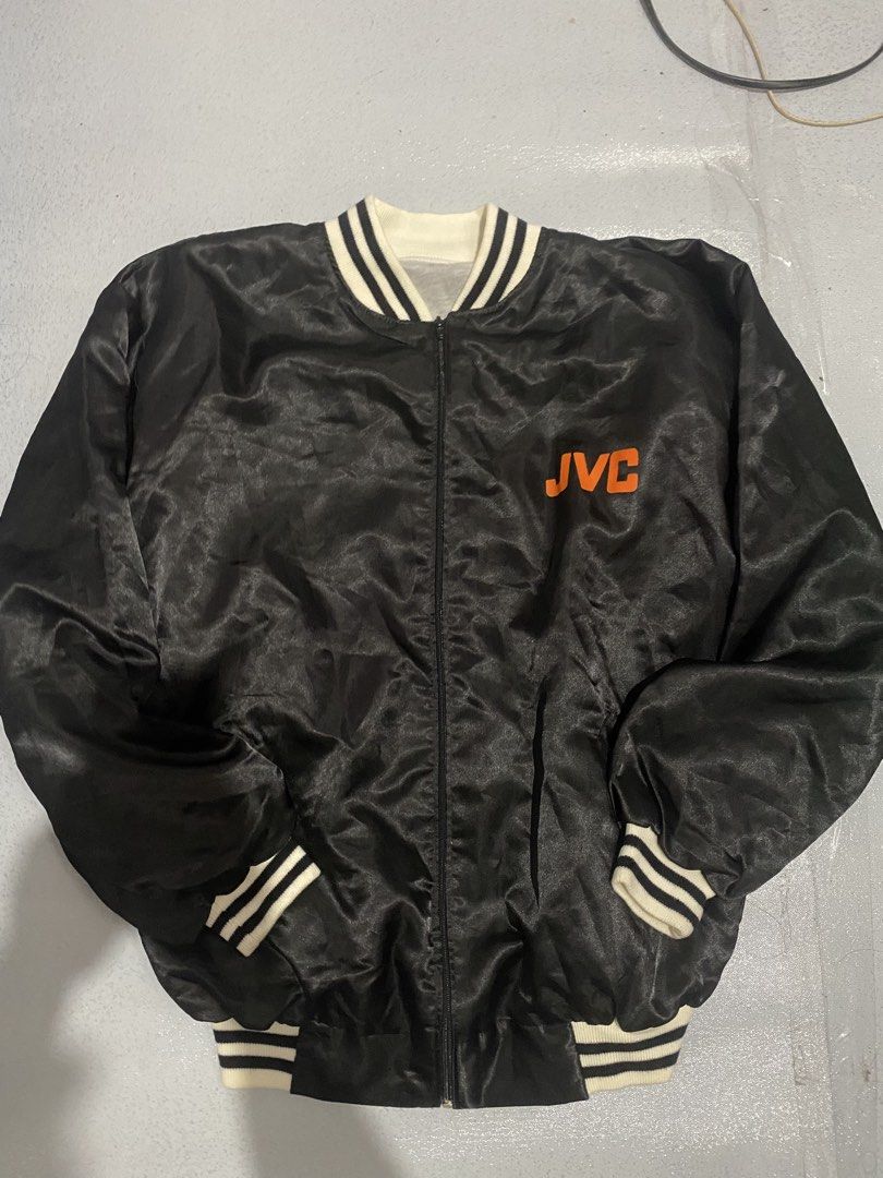 Vintage JVC Kennedy Space Center Visitor Complex Bomber Jacket (Category: Coats, Jackets and Outerwear) located in Quezon City. Submitted by wantitkept (Listing ID 1455940600, Image 2). Description: - Black satin bomber jacket - Features JVC logo on the front - Back has an astronaut graphic with Kennedy Space Center Visitor Complex text - Ribbed cuffs and collar - Zipper closure.