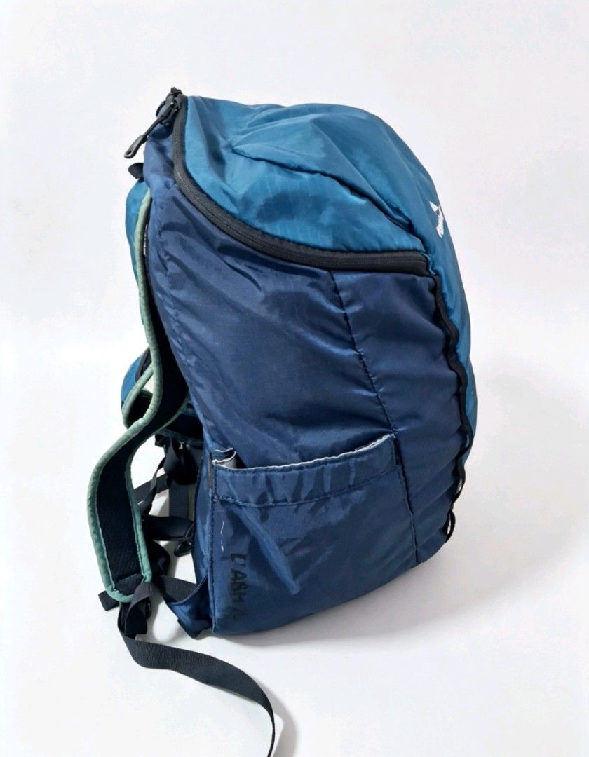 Kathmandu Blue Lightweight Foldable Hiking Backpack (Category: Backpacks) located in Angeles City. Submitted by anneps (Listing ID 1455883698, Image 3). Description: - Kathmandu backpack - Ideal for hiking or travel - Lightweight and foldable design - Padded back and straps for comfort - Multiple pockets for organization - Zippers in good working condition - Note: Minor scuffs on the side pocket.