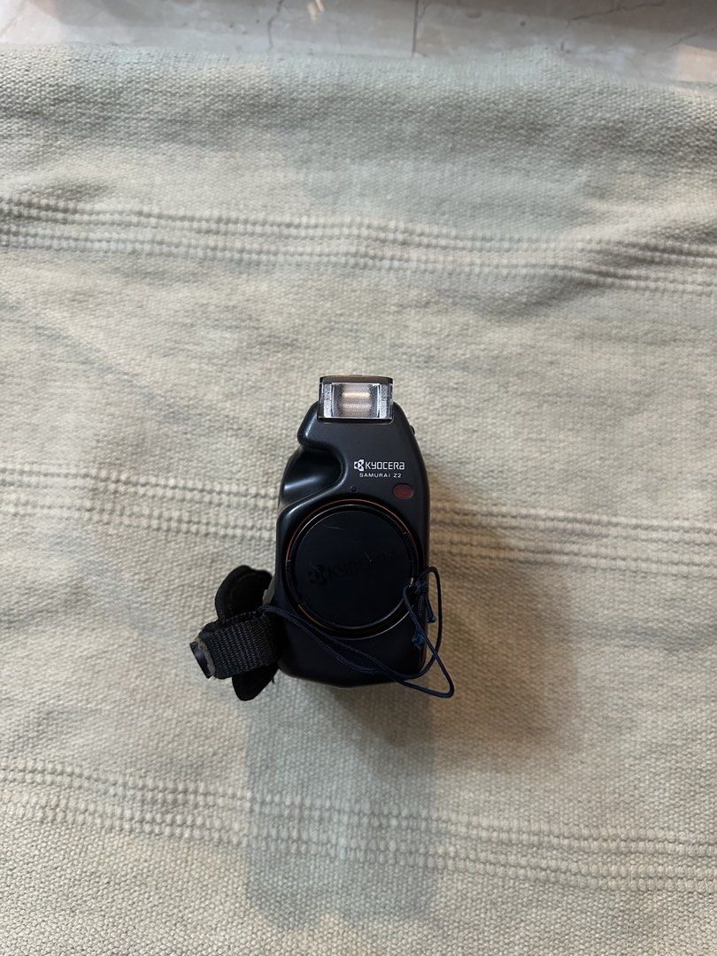 Kyocera Samurai Z2 Half Frame Film Camera (Category: Cameras) located in Manila. Submitted by rakusa95 (Listing ID 1455953478, Image 1). Description: Kyocera Samurai Z2 Half Frame Film Camera - 35mm - very good working condition - working flash - working zoom - working date back - half frame camera where a camera exposes only half of a standard 35mm film frame at a time. This turns a standard 36-exposure roll into 72 shots - 36 exp roll = 72 shot