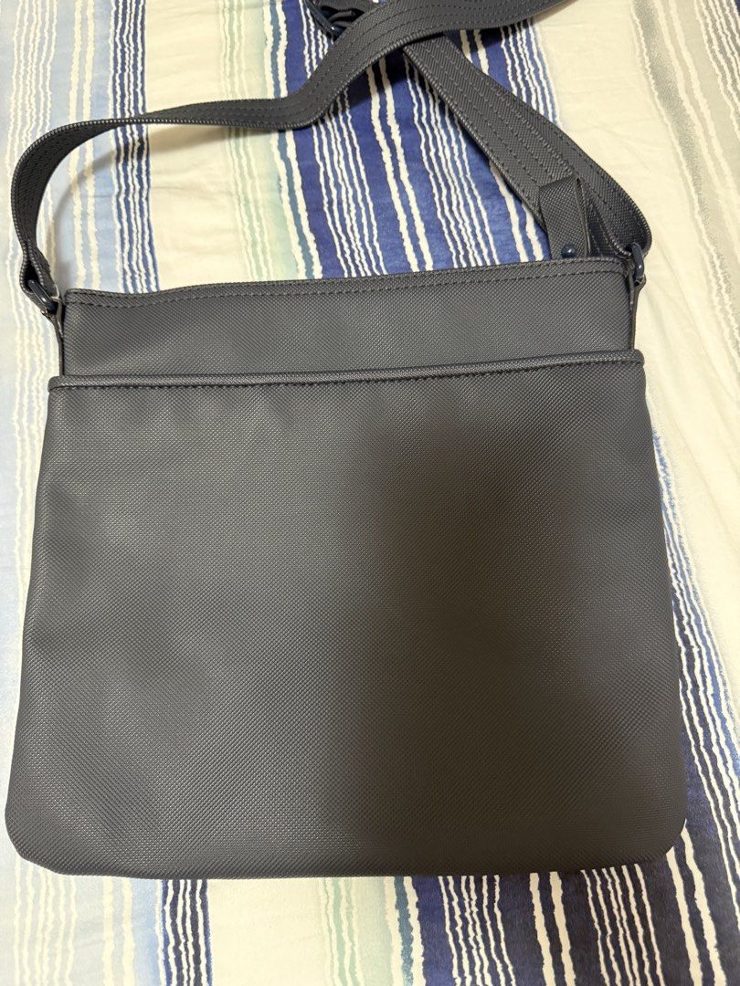 Lacoste Cross Body Bag (Category: Cross-body Bags) located in Calamba. Submitted by sofiesmerch (Listing ID 1456028836, Image 3). Description: Authentic, used few times but some minor issue on the side of the strap (see photo).