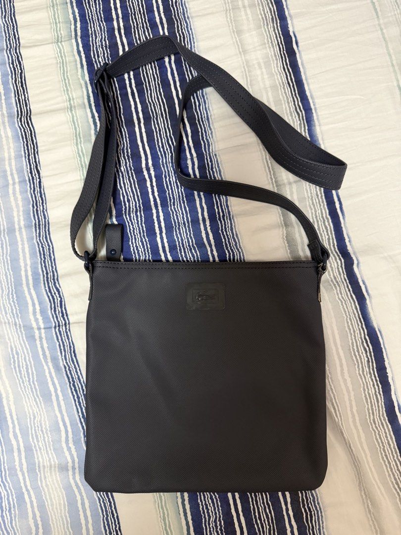 Lacoste Cross Body Bag (Category: Cross-body Bags) located in Calamba. Submitted by sofiesmerch (Listing ID 1456028836, Image 1). Description: Authentic, used few times but some minor issue on the side of the strap (see photo).