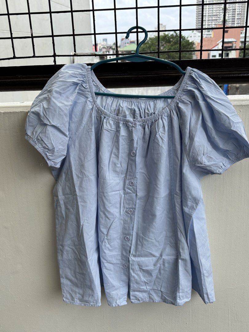 Light Blue Square Neck Puff Sleeve Button Up Top (Category: Blouses) located in Manila. Submitted by decluttergivebing (Listing ID 1455906982, Image 3). Description: - Light blue top - Square neckline - Puff sleeves - Button-up front - Embroidered details on sides - Relaxed fit - Ideal for casual wear.