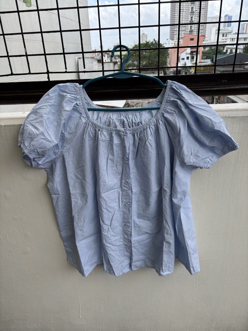 Light Blue Square Neck Puff Sleeve Button Up Top (Category: Blouses) located in Manila. Submitted by decluttergivebing (Listing ID 1455906982, Image 1). Description: - Light blue top - Square neckline - Puff sleeves - Button-up front - Embroidered details on sides - Relaxed fit - Ideal for casual wear.