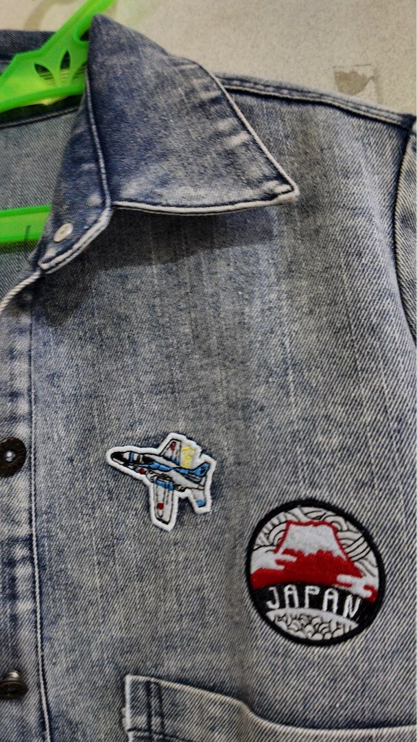 Long Denim Jacket with Patches (Category: Coats, Jackets and Outerwear) located in Malabon City. Submitted by jhensengo (Listing ID 1456013618, Image 3). Description: - Cool long denim jacket - Acid wash effect - Embroidered patches: Eiffel Tower, Union Jack, suitcase, fighter jet, Japan/Mt. Fuji - Frayed hem and cuffs - Button-up front - Two chest pockets - Great statement piece.