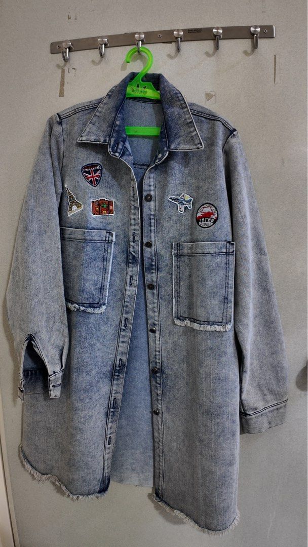 Long Denim Jacket with Patches (Category: Coats, Jackets and Outerwear) located in Malabon City. Submitted by jhensengo (Listing ID 1456013618, Image 1). Description: - Cool long denim jacket - Acid wash effect - Embroidered patches: Eiffel Tower, Union Jack, suitcase, fighter jet, Japan/Mt. Fuji - Frayed hem and cuffs - Button-up front - Two chest pockets - Great statement piece.
