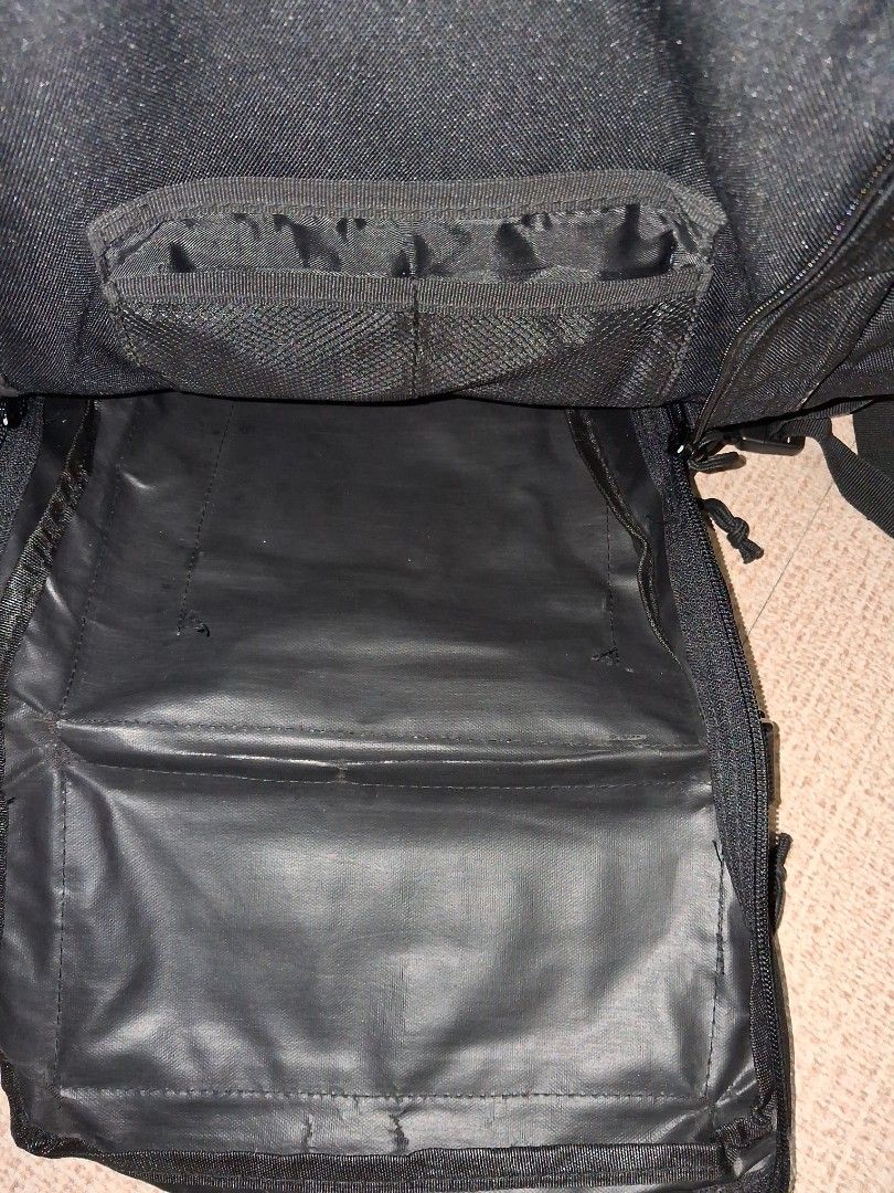 Military Backpack (Category: Backpacks) located in Angeles City. Submitted by anneps (Listing ID 1455943410, Image 3). Description: - Durable black tactical backpack - Approx. 20 inches in length - MOLLE webbing for customizable attachments - Multiple zippered compartments for organized storage - Adjustable straps for a comfortable fit.