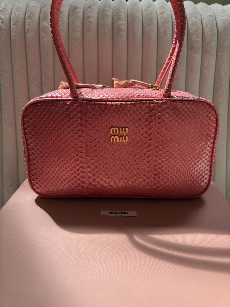 Miu Miu Beau (Category: Luxury Bags & Wallets) located in Quezon City. Submitted by kingwolf824 (Listing ID 1455910852, Image 3). Description: MIU MIU Ayers Medium Beau Top Handle Bag in Petal Pink. This is a super rare find! This looks so good in person! The dual top zippers open to a soft pink leather interior with zipper pockets on both sides. Comes with box and dustbag. No returns, No exchange, No refunds..