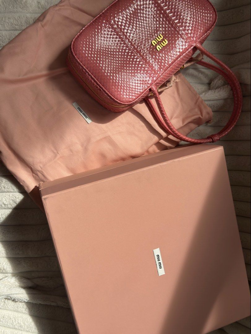 Miu Miu Beau (Category: Luxury Bags & Wallets) located in Quezon City. Submitted by kingwolf824 (Listing ID 1455910852, Image 2). Description: MIU MIU Ayers Medium Beau Top Handle Bag in Petal Pink. This is a super rare find! This looks so good in person! The dual top zippers open to a soft pink leather interior with zipper pockets on both sides. Comes with box and dustbag. No returns, No exchange, No refunds..