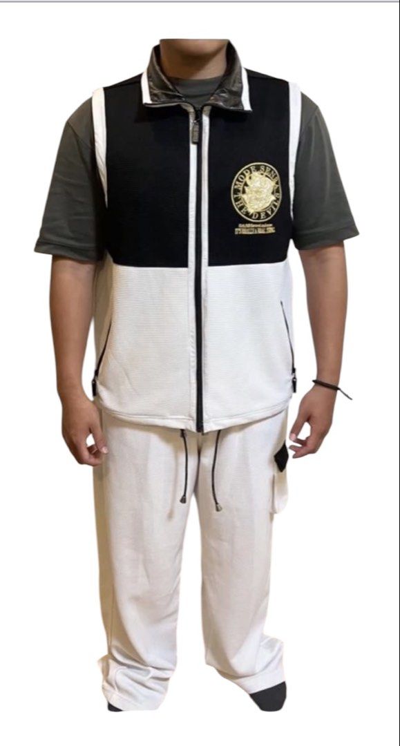 Mode Senba The Devil Black White Tracksuit Vest & Pants Set (Category: Sets & Coordinates) located in Quezon City. Submitted by letsdeclutter101 (Listing ID 1455904709, Image 1). Description: - Black and white tracksuit set - best fits 5'7 n above - Waffle knit material - Zip-up vest with devil graphic on back - Graphic details: 'Mode Senba The Devil', 'It's Really A Real Thing' - Pants with drawstring waist and back pockets - Ideal for streetwea