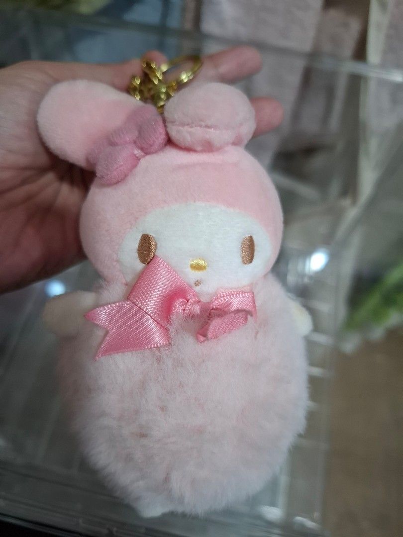 My Melody Pink Plush Keychain with Bow (Category: Plushies & Soft Toys) located in Orion. Submitted by timburtonfan (Listing ID 1455978297, Image 1). Description: - Adorable pink My Melody plush keychain. - Features a cute pink bow on the front and ear. - Comes with a durable gold chain and clip. - Ideal accessory for decorating bags or attaching to keys. - Made from soft and fluffy material for a cuddly feel..
