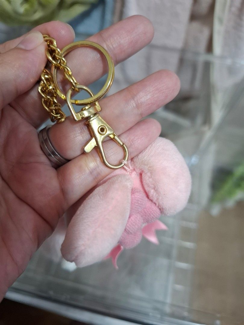 My Melody Pink Plush Keychain with Bow (Category: Plushies & Soft Toys) located in Orion. Submitted by timburtonfan (Listing ID 1455978297, Image 2). Description: - Adorable pink My Melody plush keychain. - Features a cute pink bow on the front and ear. - Comes with a durable gold chain and clip. - Ideal accessory for decorating bags or attaching to keys. - Made from soft and fluffy material for a cuddly feel..