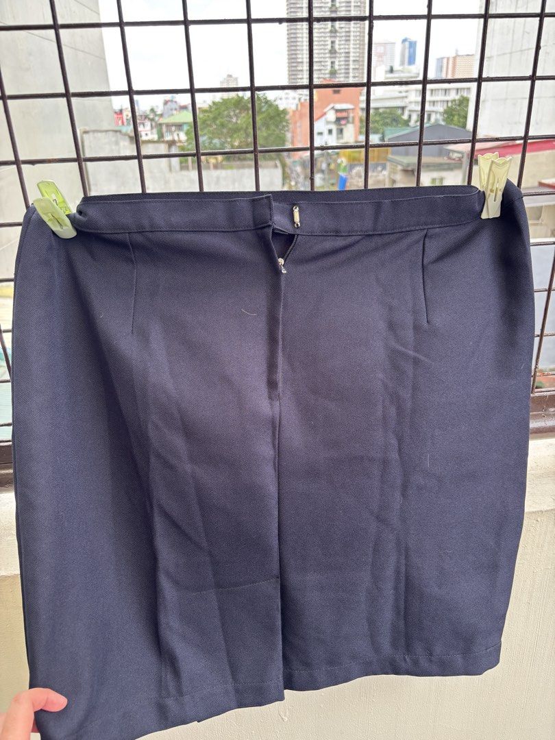 Navy Blue Mini Skirt with Button and Zip Closure (Category: Skirts) located in Manila. Submitted by decluttergivebing (Listing ID 1455907114, Image 2). Description: - Classic navy blue mini skirt - Front button and zip closure - Versatile for casual or work outfits - Effortless to pair with various tops.