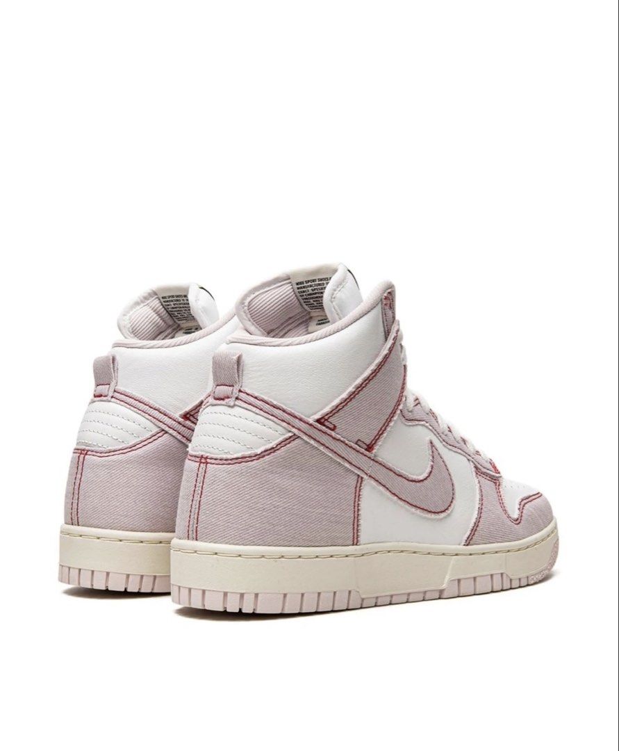 Nike Dunk High White Pink Stitch Denim Sneakers (Category: Sneakers) located in Quezon City. Submitted by timelessfinds (Listing ID 1456005335, Image 3). Description: - White and pink denim Nike Dunks - High-top style - Red stitching details - Cream sole - Clean appearance - Ideal for casual wear or collection.