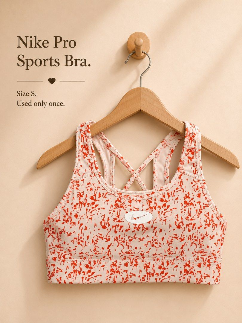 Nike Pro Sports Bra Size S (Category: Activewear) located in Bacolor. Submitted by jslpnd (Listing ID 1455991042, Image 1). Description: - Nike Pro Sports Bra - Size: S - Condition: Worn only once (like new!) - Design: Eye-catching red and white abstract print - Features: Trendy strappy back - 💯 original.