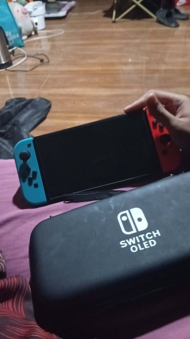 Nintendo Switch OLED (Category: Nintendo) located in Caloocan City. Submitted by calmriver-9ae27b (Listing ID 1455984376, Image 3). Description: For sale nintendo switch oled 10k nalang. Free 2 games (Pokemon Legends ZA, Pokemon Sheild) and other accesories. Reason for sale: naka tambay nalang. PM for more details. Negotiable for 9,500 - 10,000.