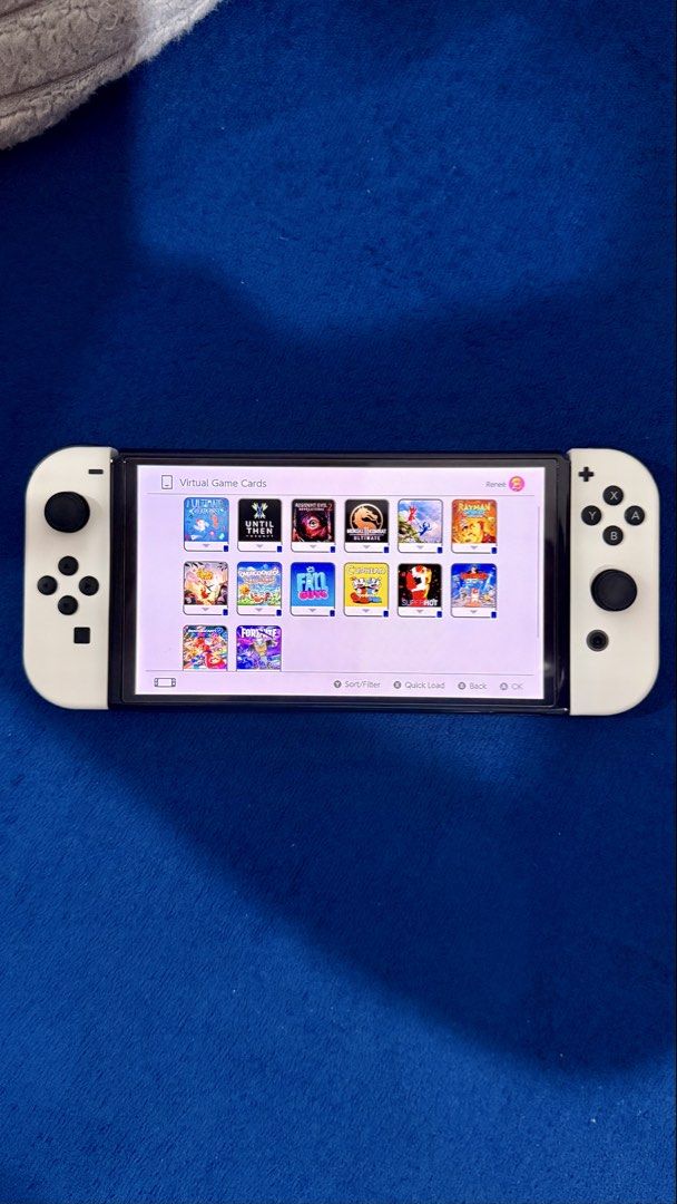 Nintendo Switch OLED – LIKE NEW + 14 Games + 2 Controllers (Category: Nintendo) located in Makati City. Submitted by renee832 (Listing ID 1456022340, Image 2). Description: Selling my Nintendo Switch OLED in excellent / like-new condition. Only used for around 35 hours in total, so it has had very little use. The console is 100% working and has absolutely no scratches, dents, marks, or damage. It genuinely looks and feels like a brand-new unit. �