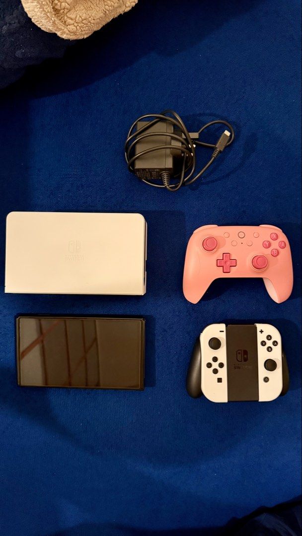Nintendo Switch OLED – LIKE NEW + 14 Games + 2 Controllers (Category: Nintendo) located in Makati City. Submitted by renee832 (Listing ID 1456022340, Image 1). Description: Selling my Nintendo Switch OLED in excellent / like-new condition. Only used for around 35 hours in total, so it has had very little use. The console is 100% working and has absolutely no scratches, dents, marks, or damage. It genuinely looks and feels like a brand-new unit. �